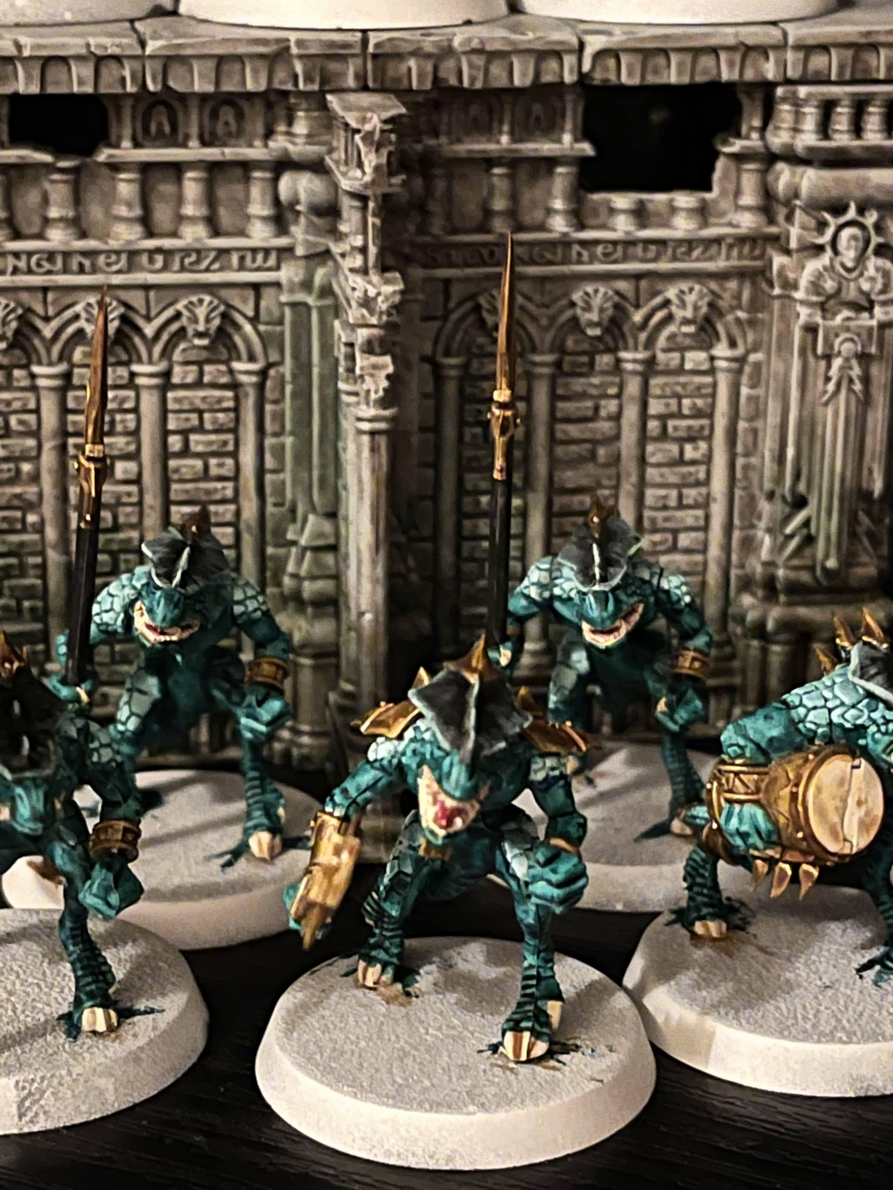 "A group shot of a bunch of saurus warriors"